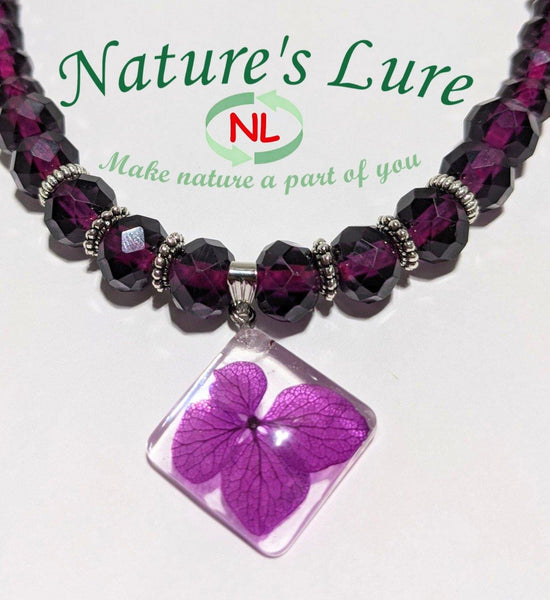 Royal Depth: Purple glass bead necklace with diamond shaped flower pendant - Nature's Lure