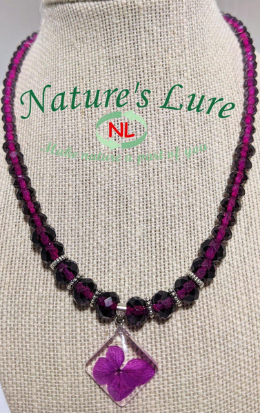 Royal Depth: Purple glass bead necklace with diamond shaped flower pendant - Nature's Lure