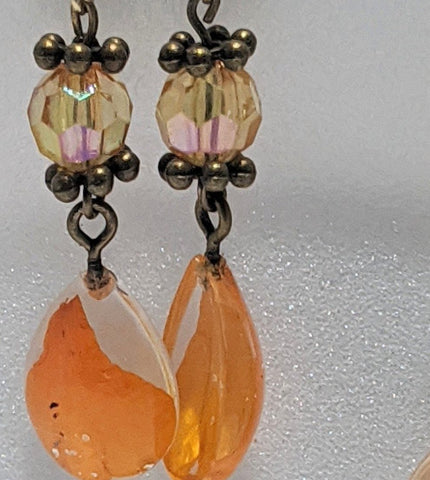 Orange bead earrings with flower petal resin pendant: Shiny Passion II - Nature's Lure