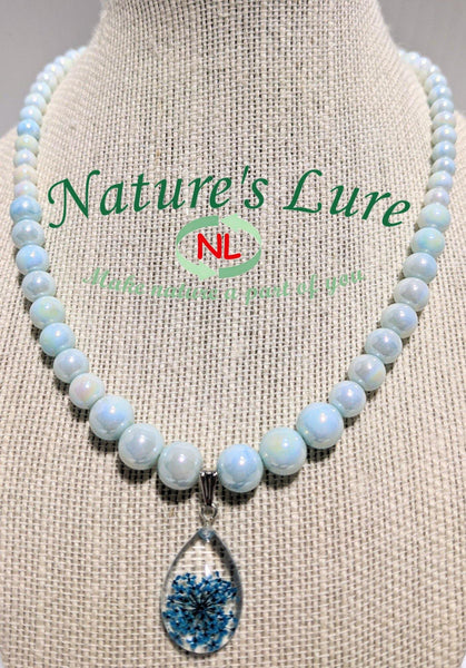 Smooth Royalty: Faint blue glass pearl necklace with teardrop shaped flower pendant - Nature's Lure